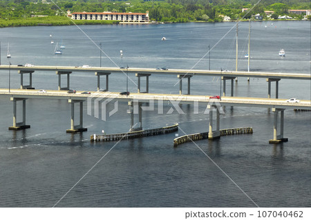 Barron Collier Bridge and Gilchrist Bridge in Florida with moving traffic. Transportation infrastructure in Charlotte County connecting Punta Gorda and Port Charlotte over Peace River 107040462