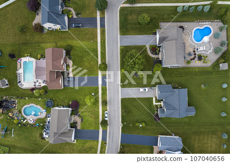 Aerial view of spacious new family houses in upstate New York suburban area. Real estate development in american suburbs 107040656