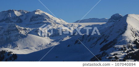 Wildstrubel and Glacier De La Plain Morte. High mountain and glacier in the Bernese Oberland in winter. 107040894