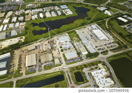 Aerial view of industrial park with goods warehouses and logistics centers in city zone from above Aerial view of industrial park with goods warehouses and logistics centers in city zone from above 107040936