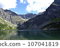 A green water lake in mountains cloudy weather. 'Czarny staw gasienicowy' lake in Tatry, Poland 107041819