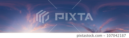 Sunset sky panorama with bright glowing pink Cirrus clouds. Seamless hdr 360 panorama in spherical equirectangular format. Full zenith for 3D visualization, sky replacement for aerial drone panoramas. 107042187