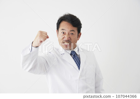 Furious middle-aged doctor white background Furious middle-aged doctor white background 107044366