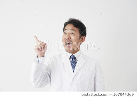 A middle-aged doctor with inspiration, white background A middle-aged doctor with inspiration, white background 107044369
