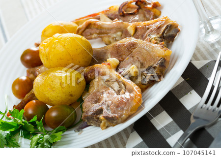 Roasted lamb ribs with potato Roasted lamb ribs with potato 107045141