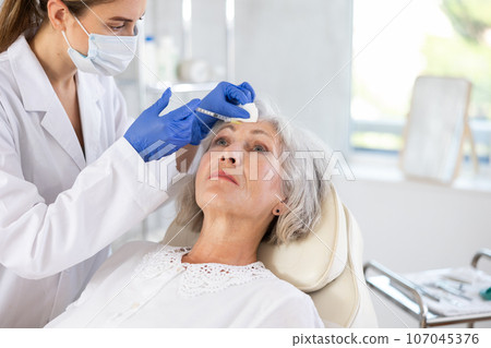 Facial injection mature patient Facial injection mature patient 107045376