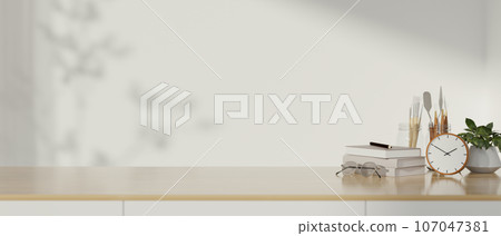 Copy space on a wooden table against the white wall with accessories. close-up image 107047381