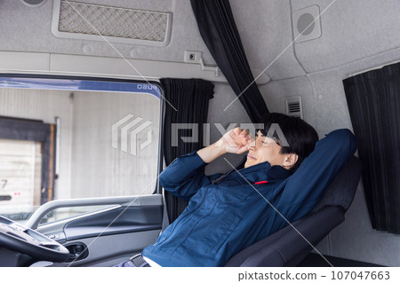 Truck driver driver taking a break 107047663