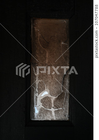 burn dirty black wood door with broken glass texture background burn dirty black wood door with broken glass texture background 107047788