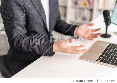 A man having a video conference 107047856