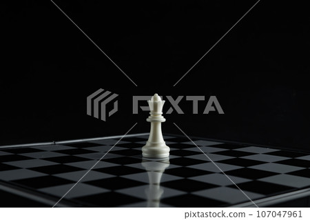 Pieces on chess board on black background for playing game and strategy. 107047961