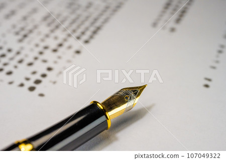 Fountain pen tip; desk Fountain pen tip; desk 107049322