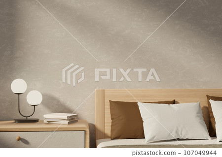 A cosy Scandinavia minimalist bedroom with a bed with comfy pillows and a bedside drawer. 107049944