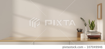 Mockup space on a minimal wooden cabinet or drawer against the white wall. 107049946