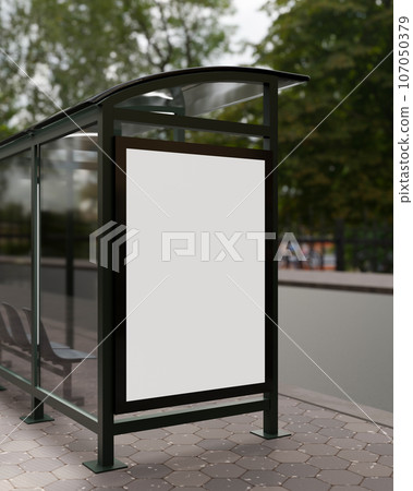 A vertical white blank billboard mockup at a bus stop on a city street. Bus stop poster mockup 107050379