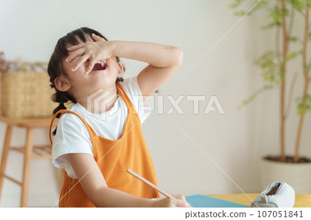 child who doesn't finish his homework 107051841