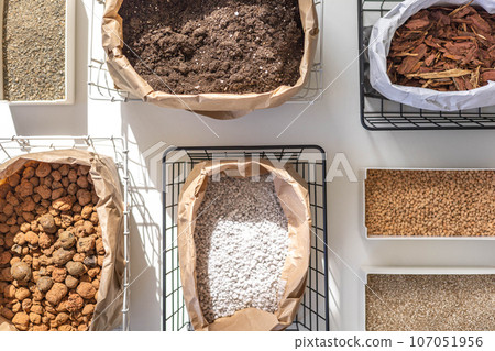 Home gardening horticulture soil drainage granules ground sand storage organizing top view isolated Home gardening horticulture soil drainage granules ground sand storage organizing top view isolated 107051956