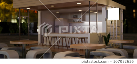 A modern and minimalist street cafe's or restaurant's outdoor seating area at night. A modern and minimalist street cafe's or restaurant's outdoor seating area at night. 107052636