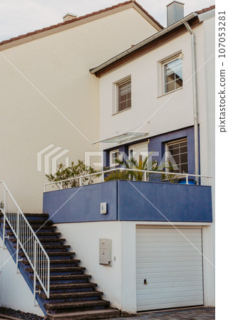 Traditional Small House With Beautiful Outdoor Decor Facade In Germany. German Old Brick Building House Ancient European City German Architect Traditional Small House With Beautiful Outdoor Decor Facade In Germany. German Old Brick Building House Ancient European City German Architect 107053281