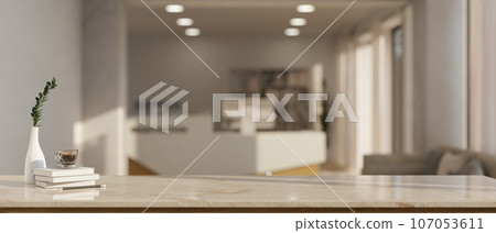 Empty mockup space on a tabletop with a blurred, modern reception room in the background. Empty mockup space on a tabletop with a blurred, modern reception room in the background. 107053611