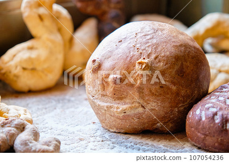 Freshly baked bread in the shape of a bun 107054236