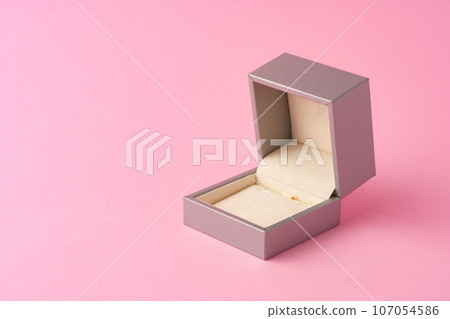 Small jewelry box on pink studio background 107054586