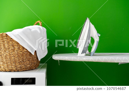 Laundry basket on washing machine in a laundry room Laundry basket on washing machine in a laundry room 107054687