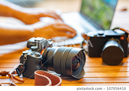 [Photographer] Camera and laptop [Desk work] 107056410