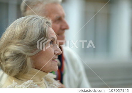 Nice elderly old couple in a autumn Nice elderly old couple in a autumn 107057345