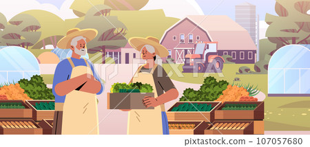 farmers holding basket full of fresh vegetables happy labor day celebration concept horizontal portrait farmers holding basket full of fresh vegetables happy labor day celebration concept horizontal portrait 107057680