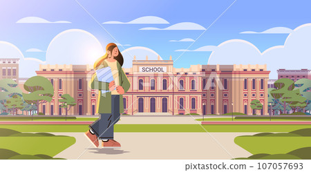 teacher with book standing near school happy labor day celebration concept horizontal teacher with book standing near school happy labor day celebration concept horizontal 107057693