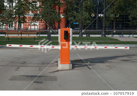 Two barriers for entry and exit from street parking Two barriers for entry and exit from street parking 107057919