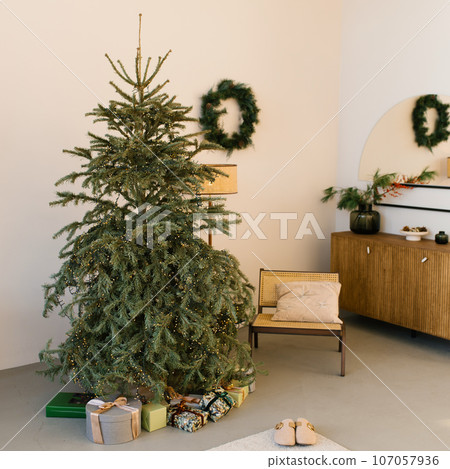 Vintage interior of a living room with a Christmas tree in a house or apartment Vintage interior of a living room with a Christmas tree in a house or apartment 107057936