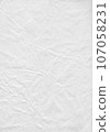 Crumpled white colored paper, wrinkled paper texture 107058231