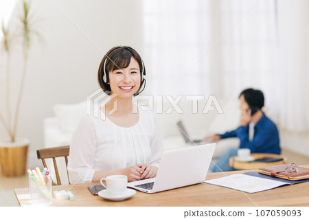 Couple teleworking from home Couple teleworking from home 107059093