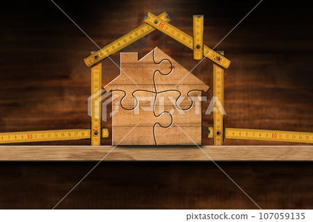 Wooden House Made From a Folding Ruler and Puzzle Pieces Wooden House Made From a Folding Ruler and Puzzle Pieces 107059135