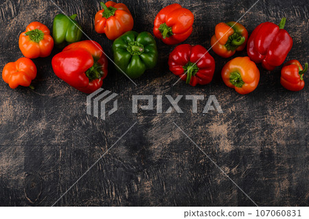 Colorful bell pepper on black background Colorful bell pepper on black background 107060831