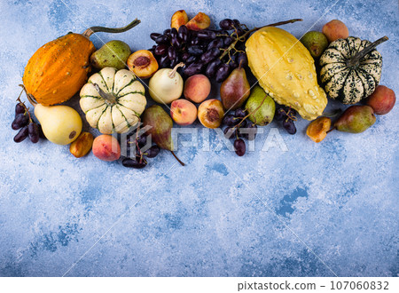 Assortment of autumn fruit. Pear, peach, grapes 107060832