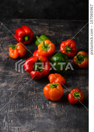Colorful bell pepper on black background Colorful bell pepper on black background 107060967