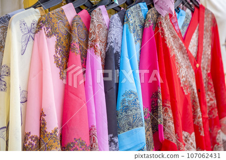 Beautiful patterned on the Thai style garment, elephant patterned for sale at local market. 107062431