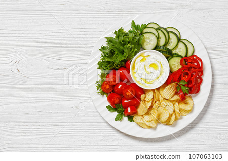 Potato Chips, leafy greens, veggies snack platter 107063103