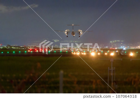 Airplane landing at Osaka International Airport 107064318