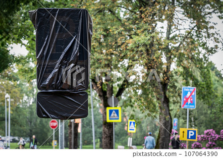 Road sign covered with a garbage bag Road sign covered with a garbage bag 107064390