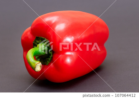 Red Bell Pepper on Black Background 107064412