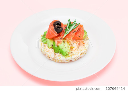 Rice Cake Sandwich with Fresh Salmon, Avocado and Olives Rice Cake Sandwich with Fresh Salmon, Avocado and Olives 107064414