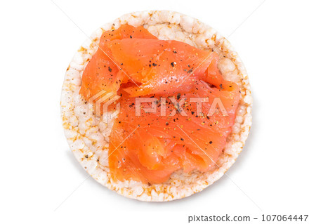Rice Cake Sandwich with Fresh Salmon Slices Isolated on White Rice Cake Sandwich with Fresh Salmon Slices Isolated on White 107064447