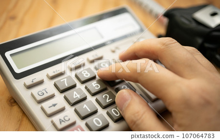 man and calculator 107064783