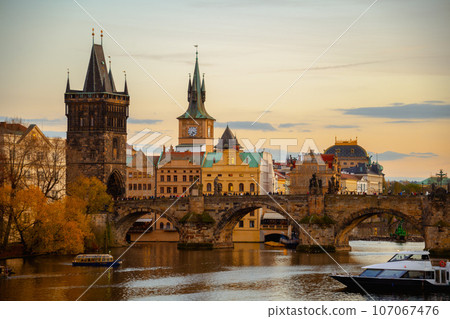 landscape with Vltava river, Charles Bridge and boat 107067476