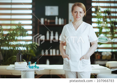 female medical massage therapist looking at camera female medical massage therapist looking at camera 107068783