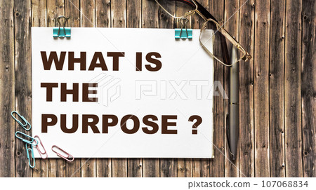 What is the purpose The text is written on a notepad and a wooden table. There are paper clips What is the purpose The text is written on a notepad and a wooden table. There are paper clips 107068834